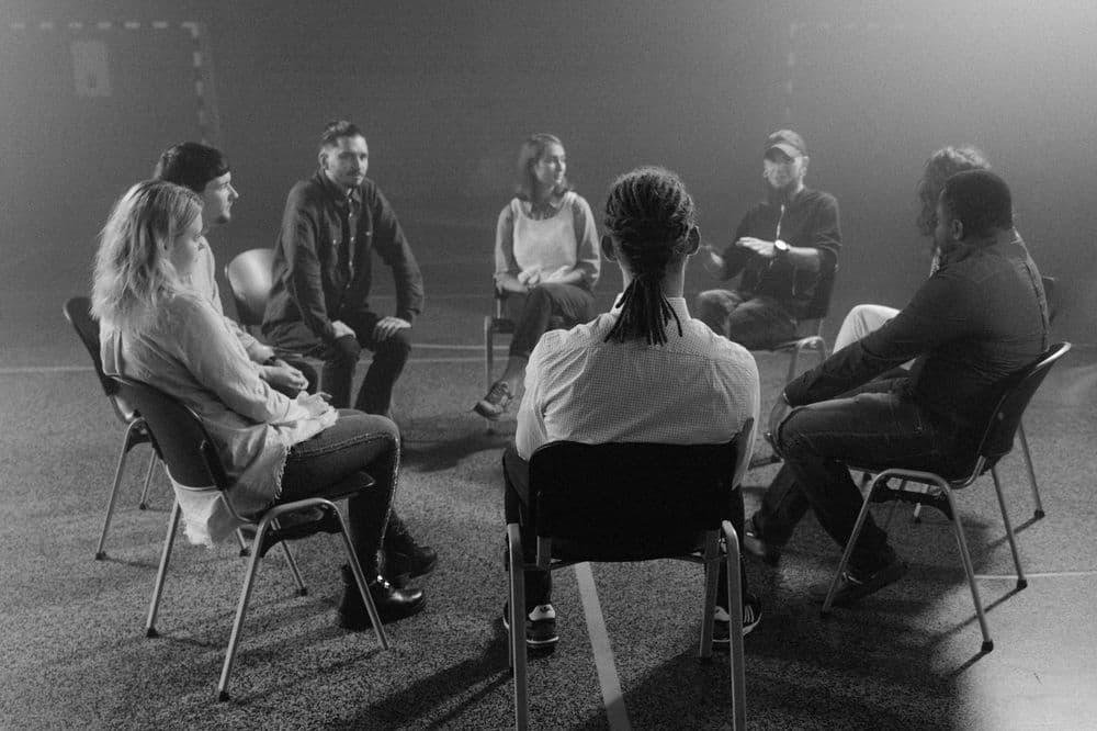 Poeple sitting in support group